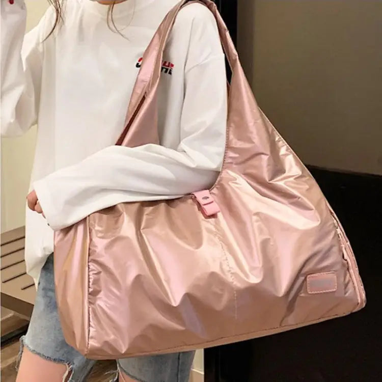 Shiny pink nylon cloth sports duffel, perfect for stylish outings and gym sessions