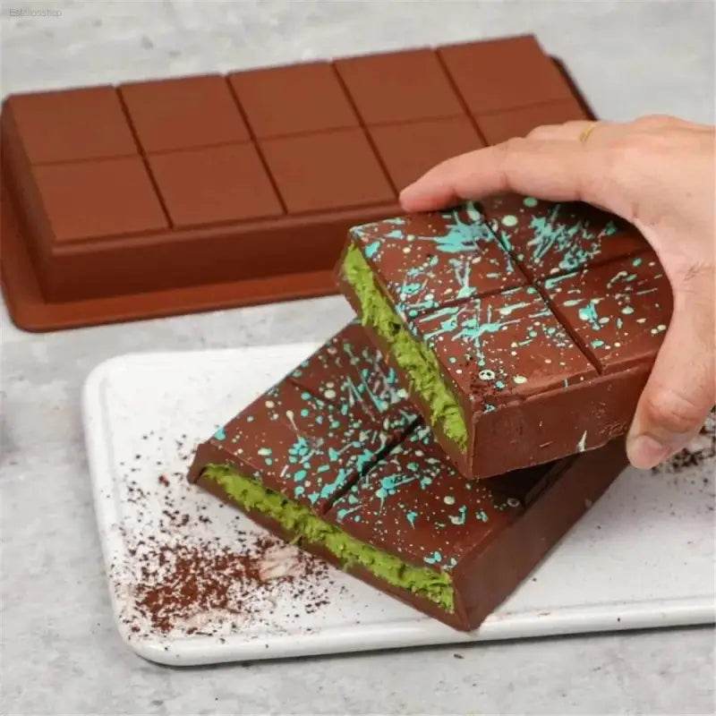 Chocolate bars with green filling and blue speckles.