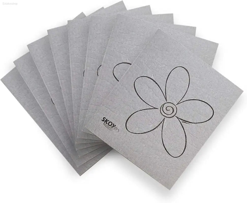 Stack of gray flower-patterned cloths.
