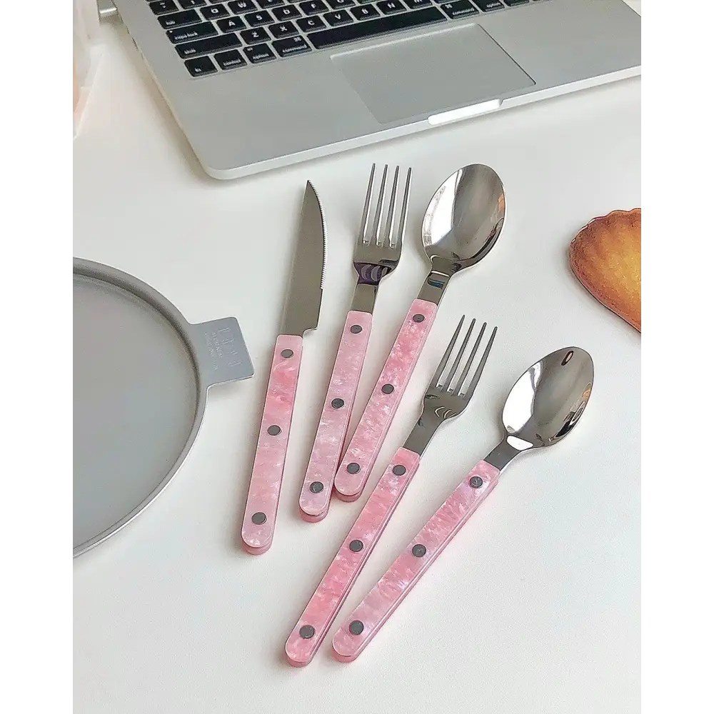 Sleek Modern Pinky Flatware Set featuring pink-handled stainless steel cutlery