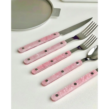 Pink-handled cutlery set in the Sleek Modern Pinky Flatware Set for stylish dining