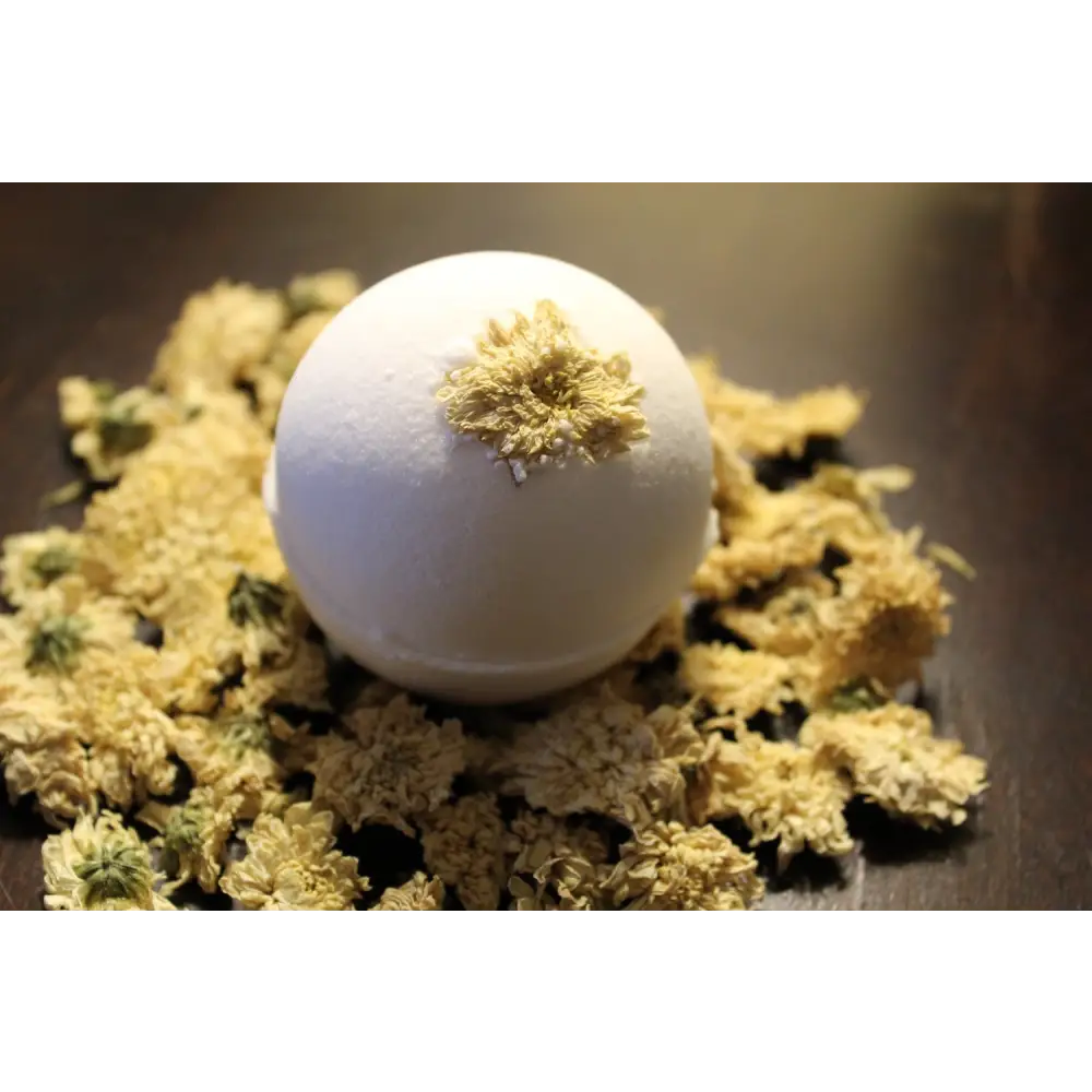 White Sleepy Chamomile Organic Baby Bath Bomb with dried flowers for a relaxing soak