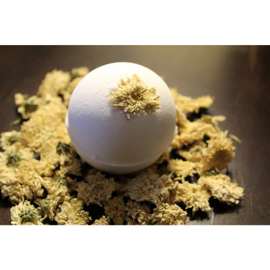 White Sleepy Chamomile Organic Baby Bath Bomb with dried flowers for a relaxing soak