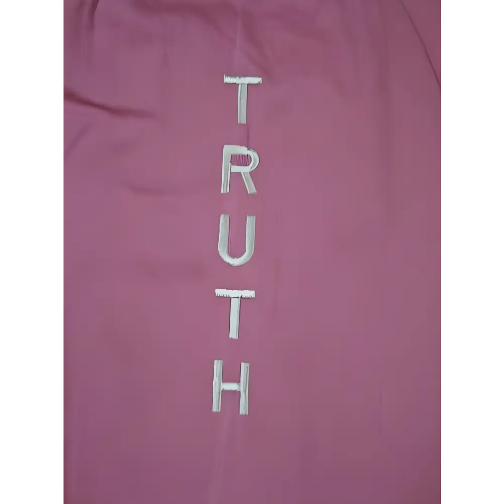 Pink fabric with embroidered TRUTH on a stylish mat bag for yogis