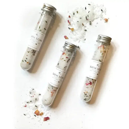 Colorful test tubes filled with Soak Shooter Soothe bath soak for a relaxing bath experience