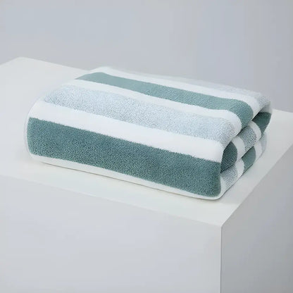 Soft and absorbent striped bath towel folded for a fresh, cozy bathroom vibe