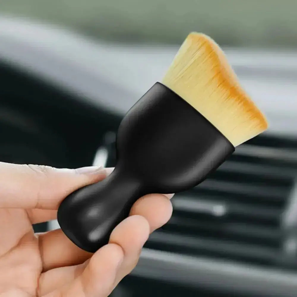 Black handled cleaning brush from Soft Brush Trio for easy car interior dust sweeping