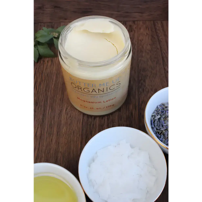 Open jar of Soothe Your Skin Organic Magnesium Lotion, creamy white texture inside