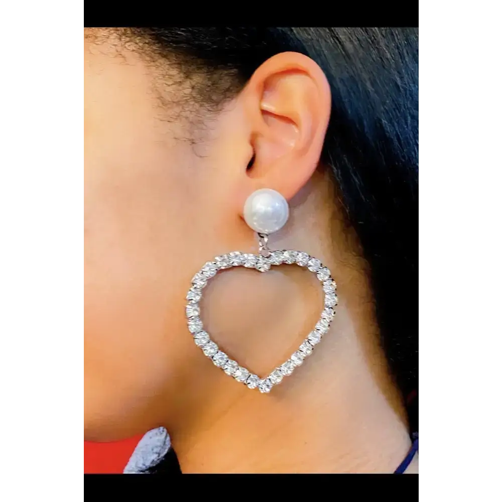 Heart-shaped crystal drop earrings with pearl studs, perfect for any fashion lover