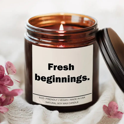 Lit Spiced Pumpkin Ginger Fresh Beginnings Candle in a cozy brown jar