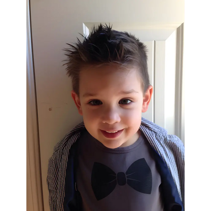 Smiling boy with spiky hair using Spidey Hair Wax Fun Organic for a cool look