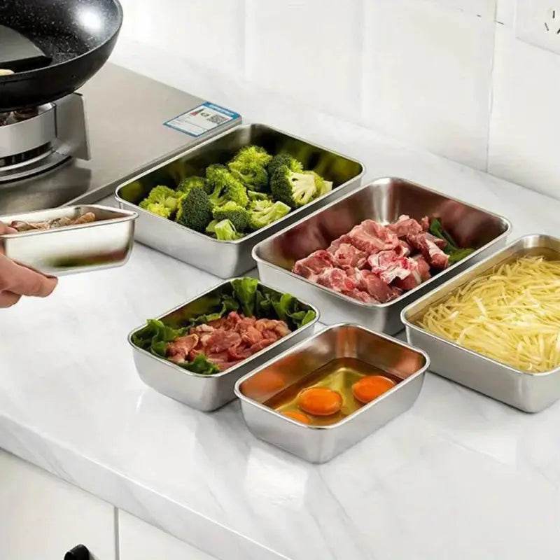 Stainless steel food preparation containers.