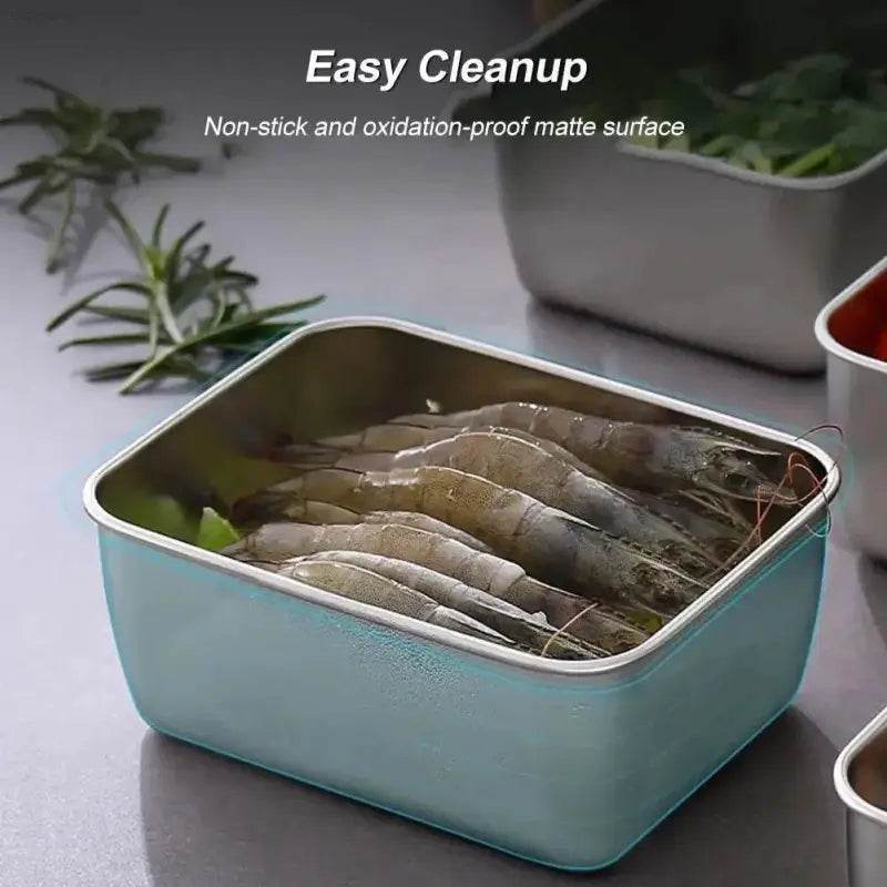 Square metal food container filled with shrimp.