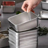Stack of rectangular metal containers.