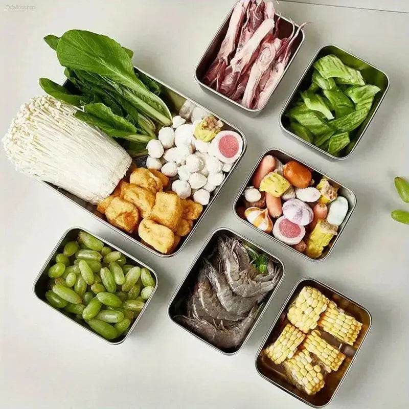 Hot pot ingredients in metal containers.