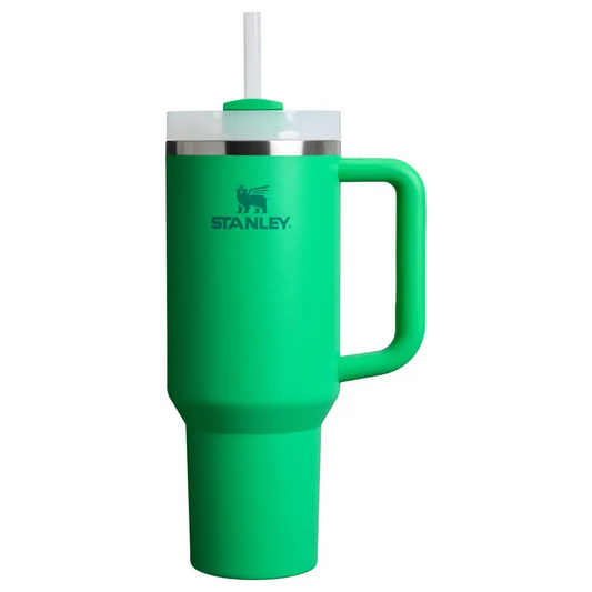 Green Stanley Quencher tumbler with handle and straw featuring vacuum insulation and rotating cover