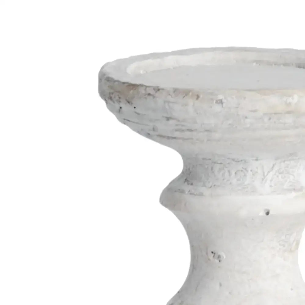 Distressed white pedestal for a charming stone candle holder transformation