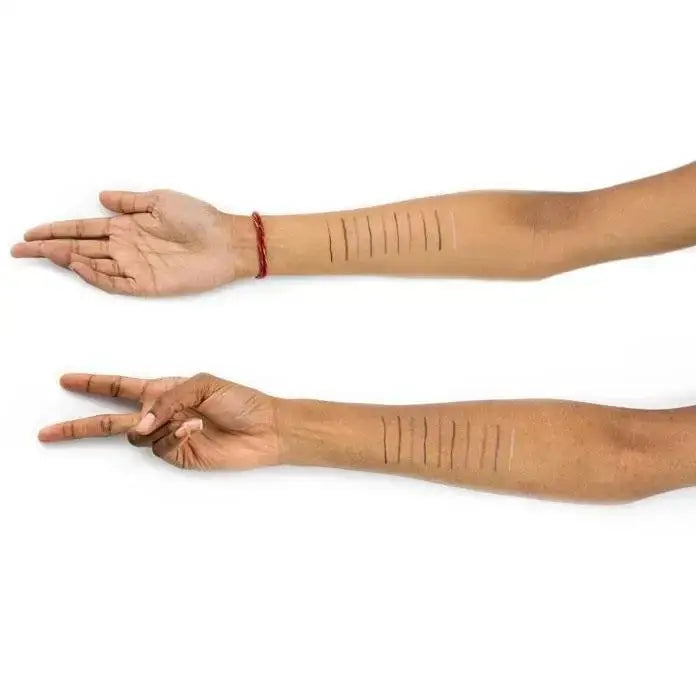 Two arms showcasing drawn lines using Suede Eye Pencil for high intensity color