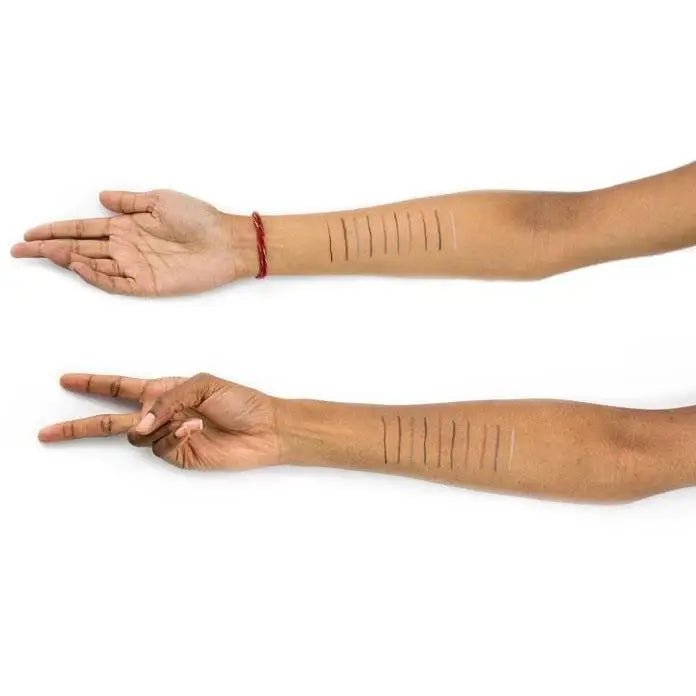 Two arms showcasing cosmetic swatches of Suede Eye Pencil High Intensity Color