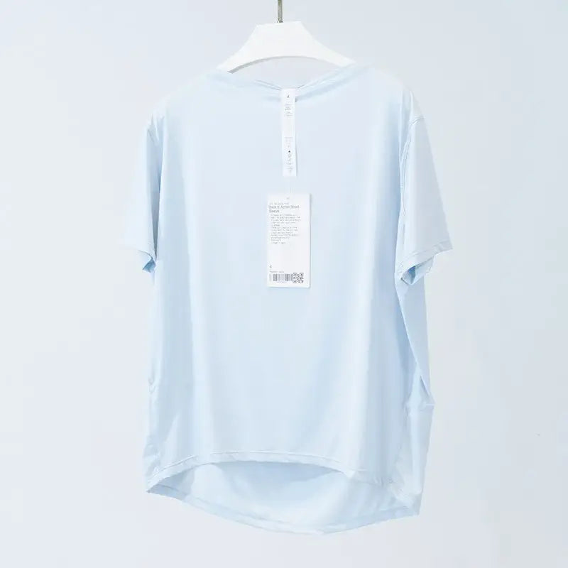 Light blue short-sleeved yoga shirt on a hanger, perfect for summer ice silk breathable comfort