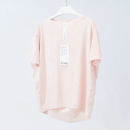 Light pink short-sleeved yoga shirt made of ice silk breathable material for ultimate comfort