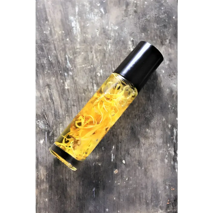 Roll-on bottle of Sunny Flower Petal Perfume Oil with organic essential oil and plant strands