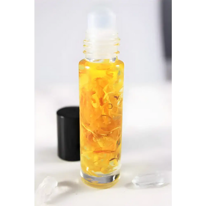 Rollerball bottle of Sunny Flower Petal Perfume Oil with yellow organic essential oil