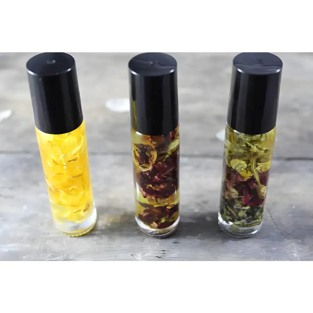 Three herbal oil roller bottles of Sunny Flower Petal Perfume Oil with organic essential oil