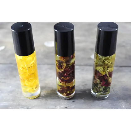 Three herbal oil roller bottles of Sunny Flower Petal Perfume Oil with organic essential oil