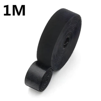 Black hook and loop tape roll from Tame Cable Chaos for easy cable organization and management