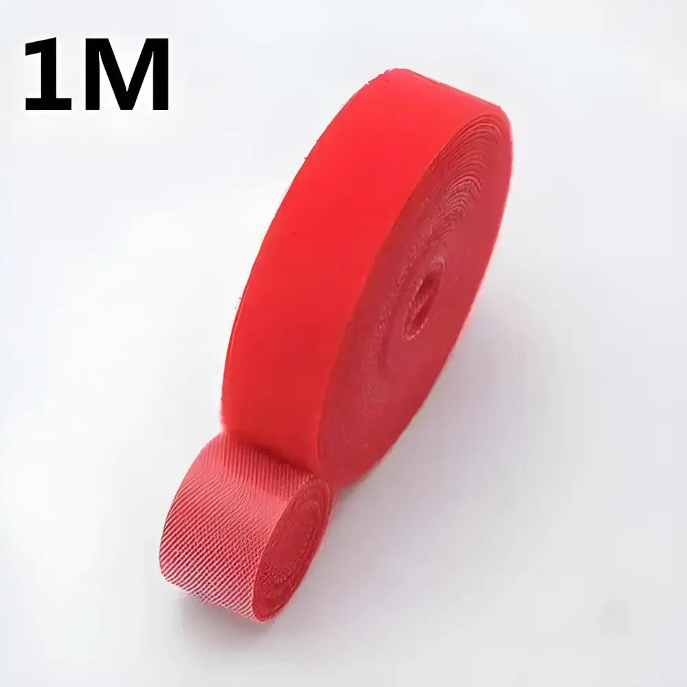 Red hook and loop fastener rolls from Tame Cable Chaos winder tape for cable management