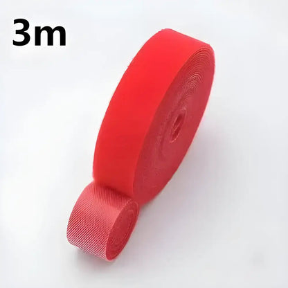 Red roll of hook and loop fastener for Tame Cable Chaos Winder Tape earphone cables