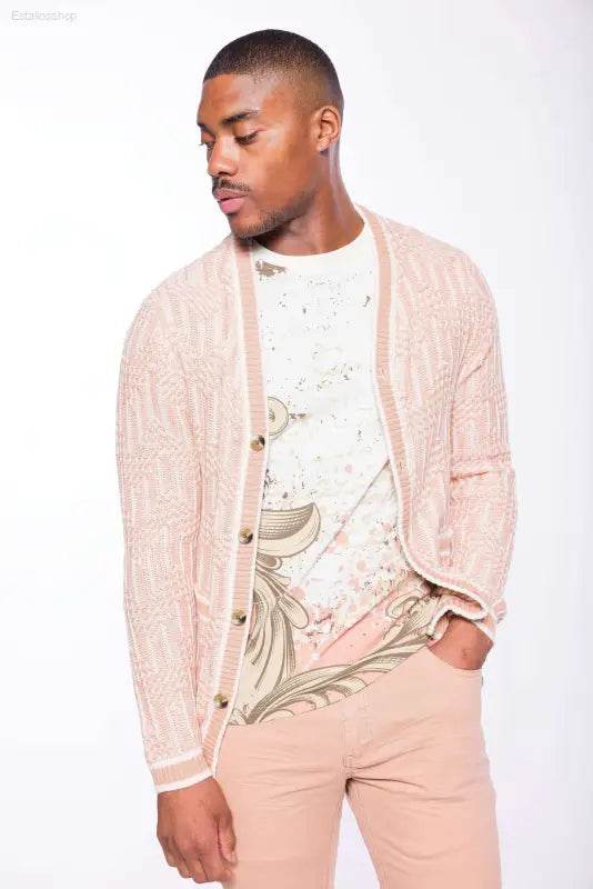 Man in pink cardigan and pants.