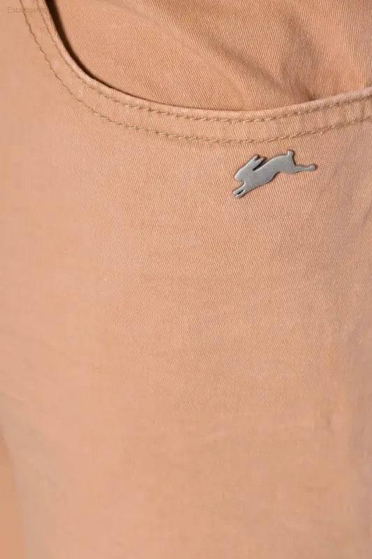 Peach-colored pants with a rabbit logo.