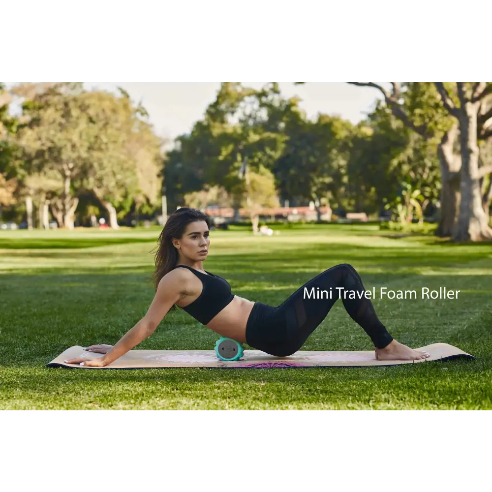 Woman using mini foam roller from the Travel Muscle Massage Bundle for relaxation