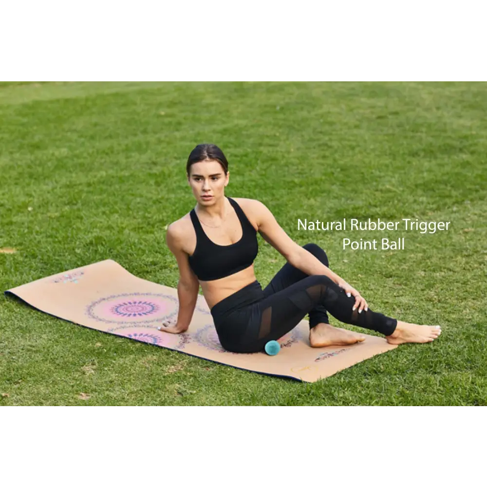 Woman using trigger point ball from the Travel Muscle Massage Bundle for relaxation