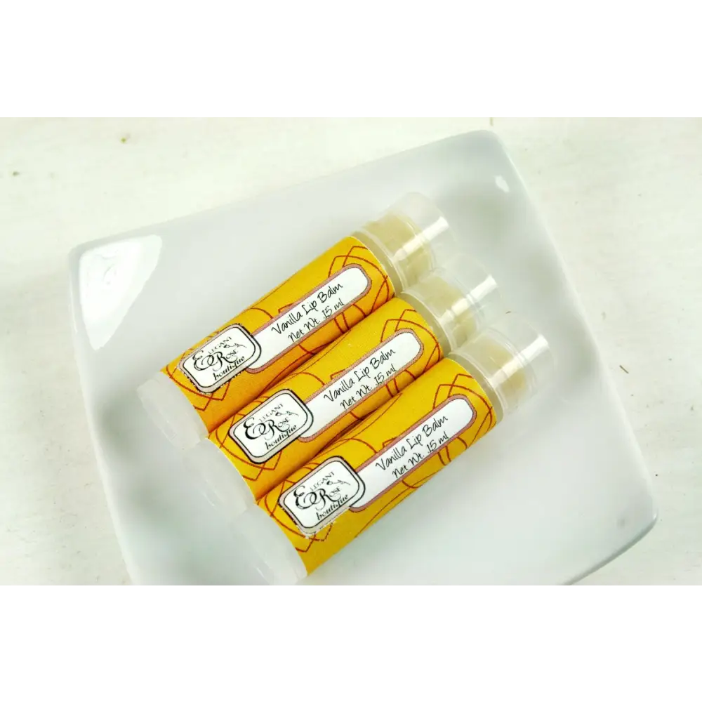 Three yellow Vanilla Lip Balms showcasing pure vanilla goodness in a cute package