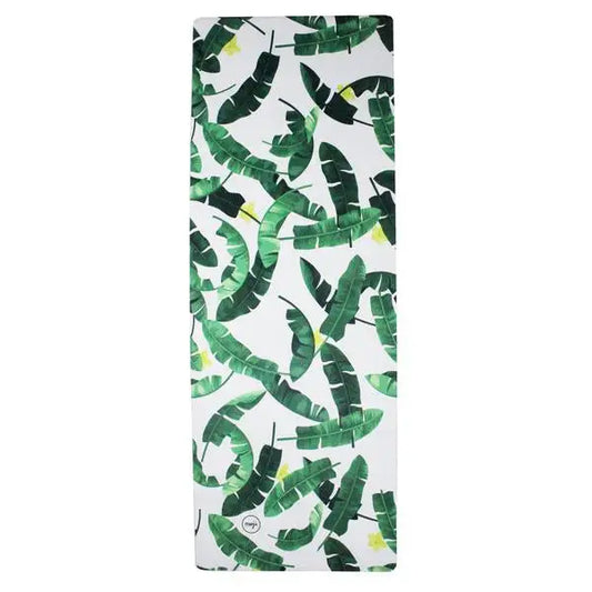 White yoga mat with green banana leaf pattern for a tropical rubber travel experience