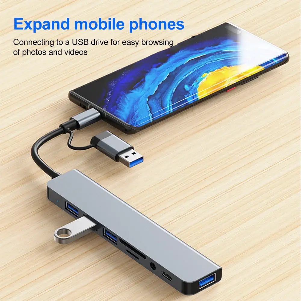 Gray USB-C hub with multiple ports connected to a smartphone as the ultimate USB extender