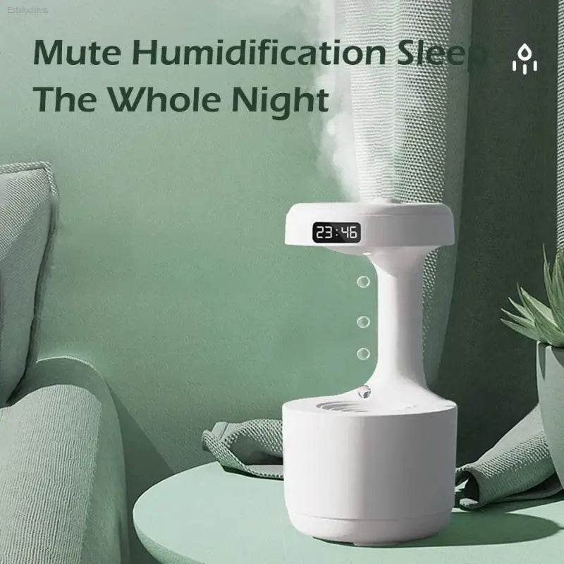 White humidifier with digital clock.