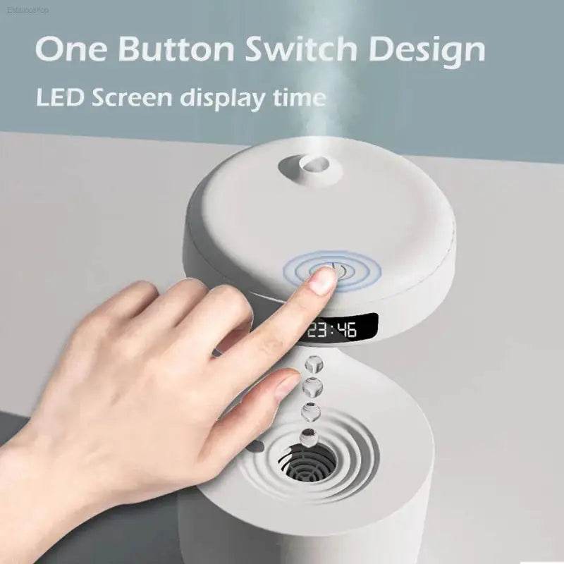 White humidifier with digital clock.