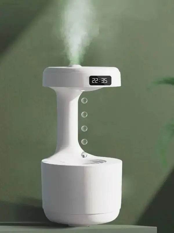 White humidifier with digital clock and simulated water droplets.