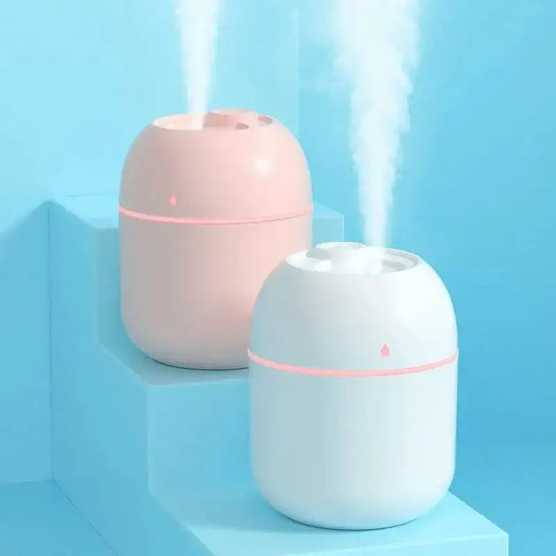 Two mini portable USB ultrasonic humidifiers and oil diffuser for car, releasing vapor