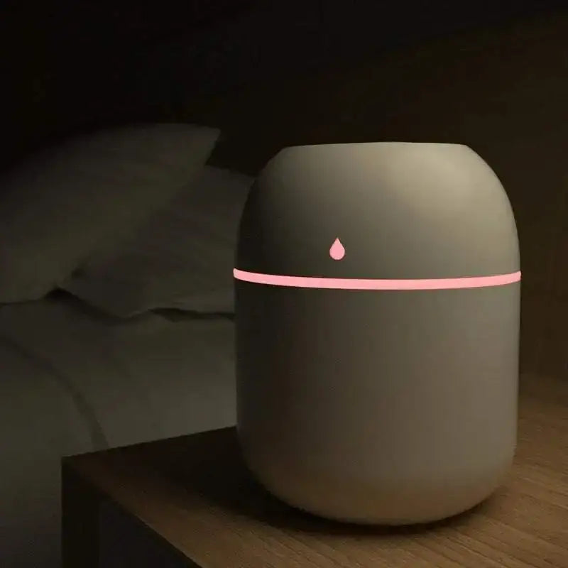 White humidifier with pink light from Ultrasonic Trio, perfect portable usb ultrasonic option