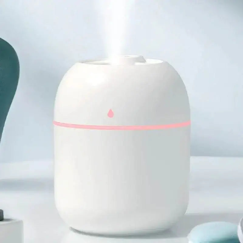 White portable USB ultrasonic humidifier emitting vapor, perfect oil diffuser car companion