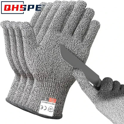 Gray cut resistant gloves by Unbeatable with a knife, perfect for kitchen safety