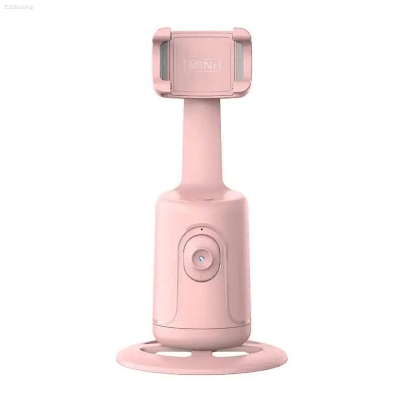 Pink phone holder with rotating base.