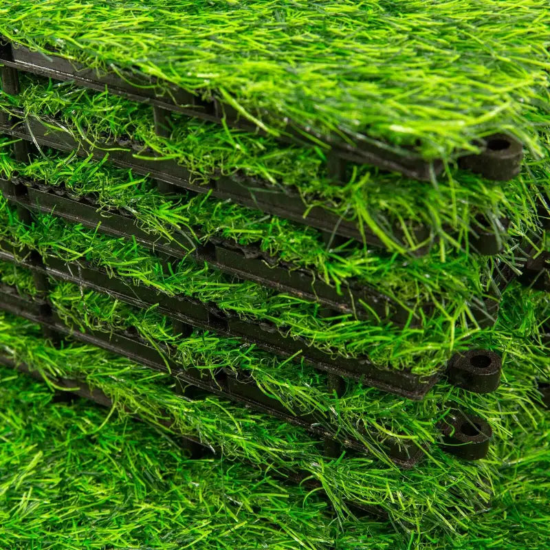 Stack of artificial grass tiles.