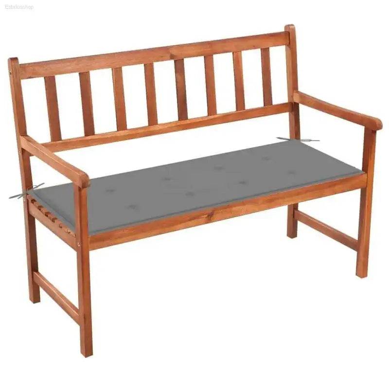 Wooden garden bench with gray cushion.