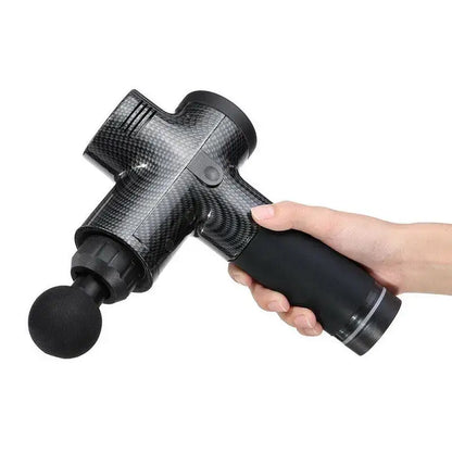 Hand holding a black massage gun from Unleash Power Massage Heads Handheld Massager